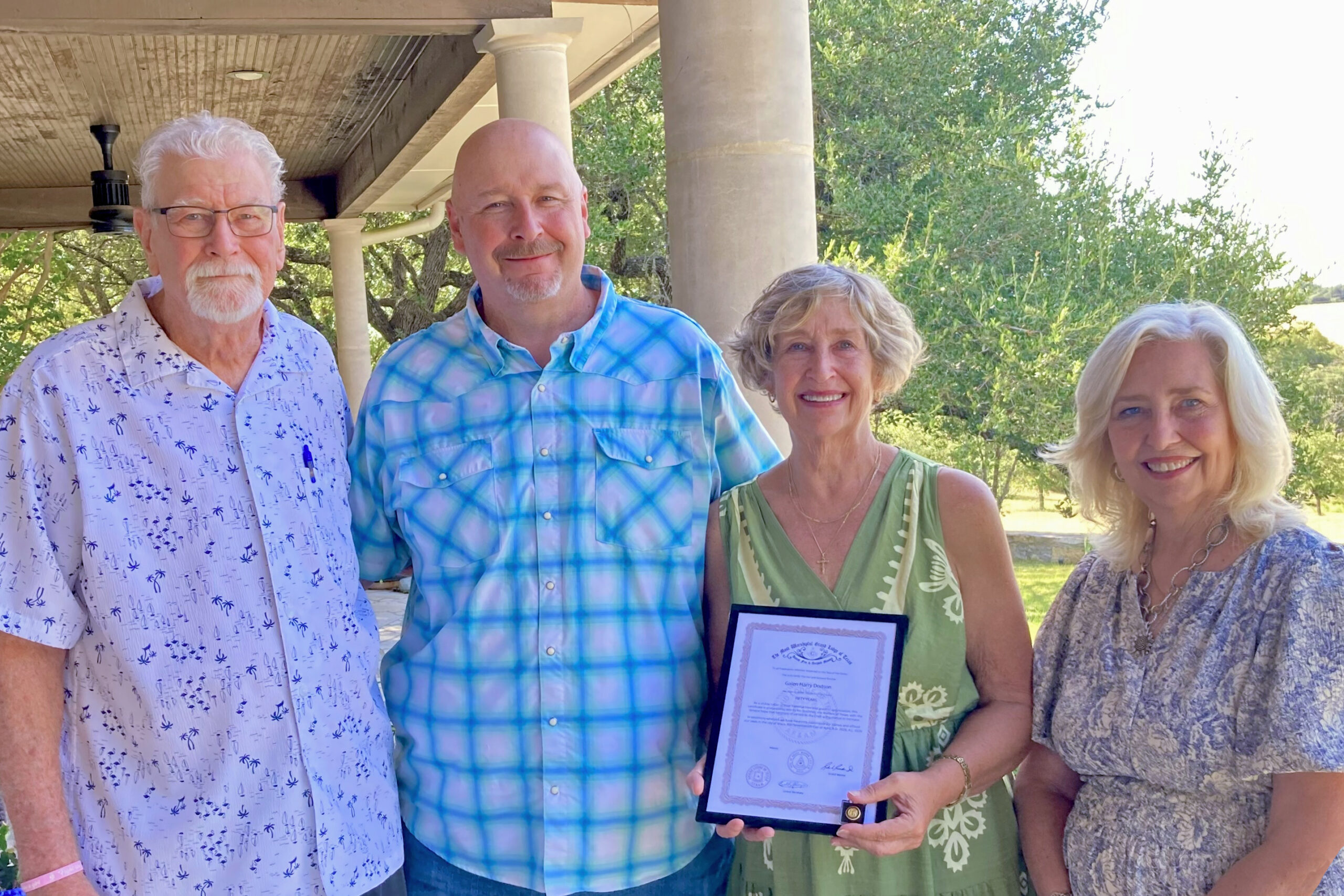Brother Galen Dodson's 50 Year Certificate and Lapel Pin from the Grand Lodge of Texas was presented posthumous to his children. From L-R, Past Master Wayland D. Clark, Andy Dodson, Gaylyn Dodson Wilson and Mary Clare Dodson Munger.  
